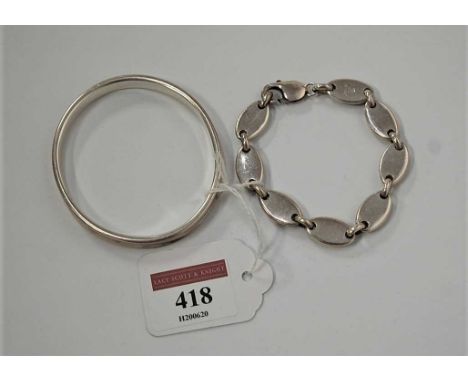 A PROBABLY Tiffany & Co silver bangle, dated 1997, dia.7cm; together with a Tiffany & Co 925 stamped silver sectional link br