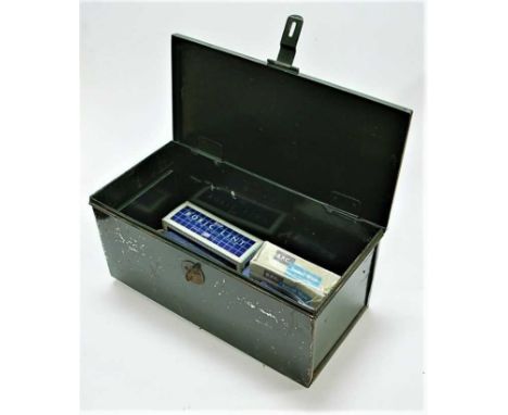 A green painted tin first aid kit