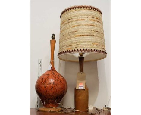 A 1970s Danish turned teak table lamp, having tapering neck with embroidered shade, h.44cm (including fittings); together wit