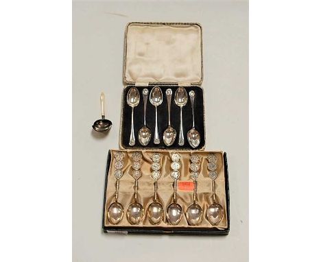 A set of six white metal spoons, each having a plain bowl, the stems embossed with Chinese symbols, stamped 900 Silver Made i