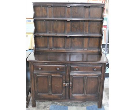 A Mid 20th Century Ercol Dresser with Panelled Cupboard Two Door Base Surmounted by Two Drawers 