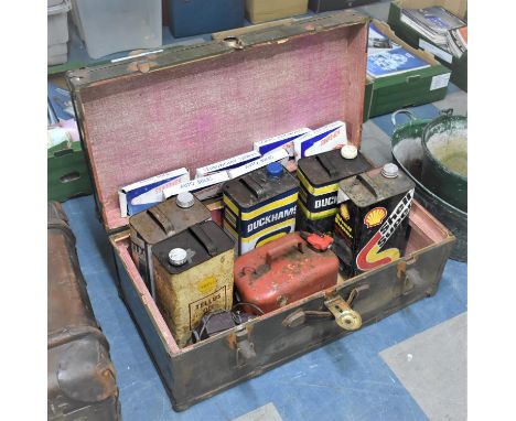 A Vintage Metal Mounted Travelling Trunk Containing Oil Cans to include Shell, Duckhams Etc Together with Car Light Bulbs 