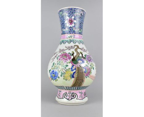 A Reproduction Chinese Porcelain Vase Decorated with Applied Enamels in the Famille Rose Palette Depicting Peacock in Blossom