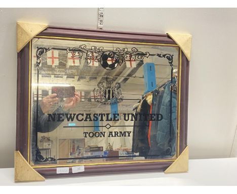 A framed Newcastle United mirror 60x50cm, shipping unavailable