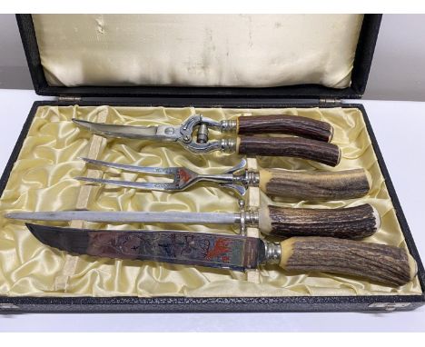 A vintage boxed Solingen carving set