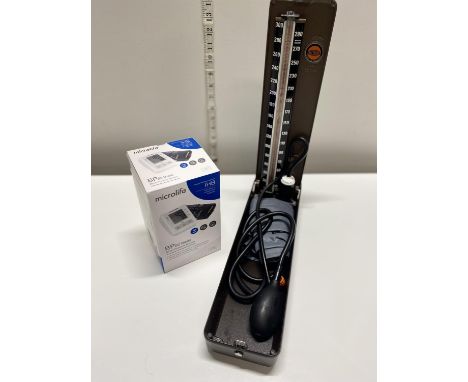 A vintage blood pressure monitor and a new digital blood pressure monitor (untested)