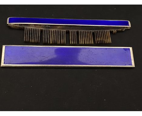 A hallmarked silver and blue enamel comb holder