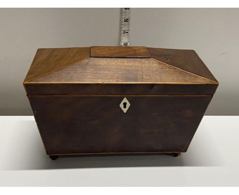 A antique mahogany tea caddy (missing interior)