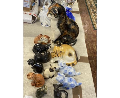 A large job lot of assorted ceramic cat figurines and a cast iron mouse, shipping unavailable