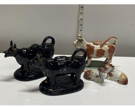 A selection of antique ceramic creamers and cow figures a/f,  shipping unavailable