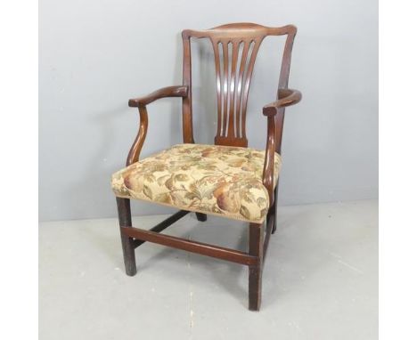 A mahogany and upholstered Chippendale style open armchair.