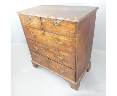 A Georgian oak chest of two short and three long drawers, raised on bracket feet. 97x103x50cm.Back panel is loose, with a fai