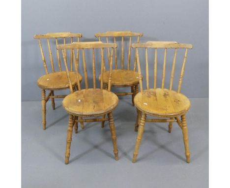 A set of four early 20th century penny seat stick-back kitchen chairs 