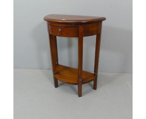 A mahogany demi-lune console table. 60x80x31cm. 