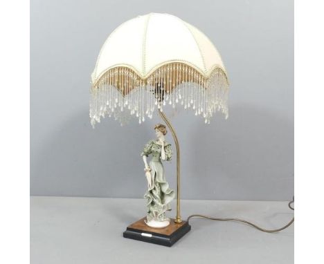 GIUSEPPE ARMANI - A mid-century Italian ceramic figural table lamp, with shade. Height to bayonet 48cm.Good condition. No obv