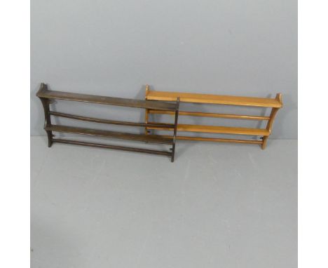 ERCOL - Two mid-century elm hanging plate racks. 96x50x13cm.Maker's label to reverse of dark shelf. 