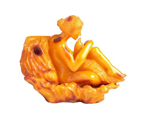 A carved Amber (reconstituted Baltic ?) figure group of Leda &amp; the Swan, 16 cm long x 13 cm high, 336 grams.It is in good