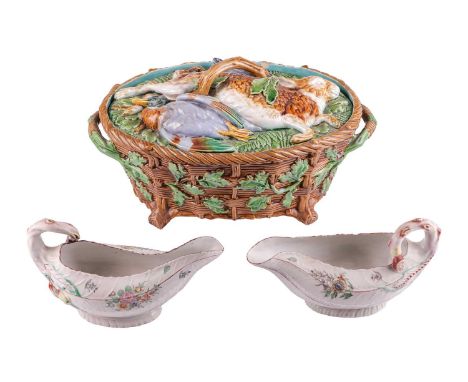 A Mintons majolica game-pie dish, 19th century, typically decorated with game to the cover and leaves to the basket week dish