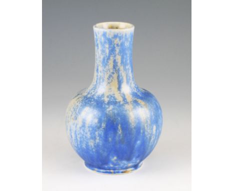 A Ruskin pottery Crystalline vase of bulbous form with waisted neck, body having a light blue and cream coloured glaze, stamp