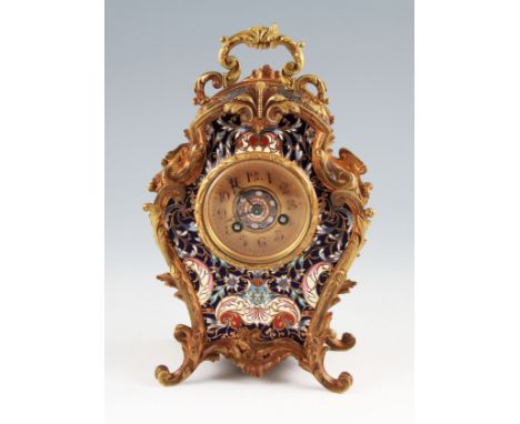 An early 20th Century French cast brass and cloisonné enamel clock, the body having and ornate cast brass frame and handle wi