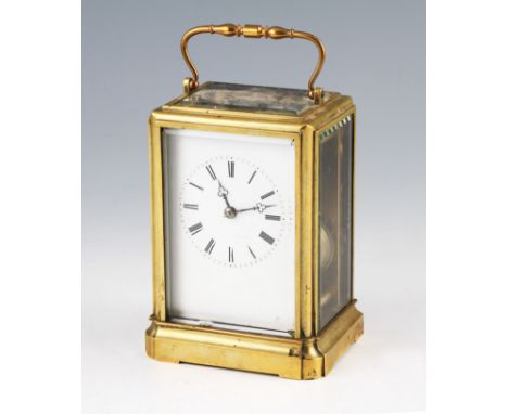 An early 20th Century brass twin barrel carriage clock by Japy Freres & Co, the brass body having bevelled edge glass panels 