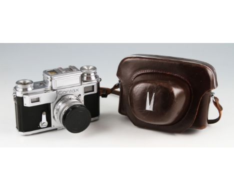 A Zeiss Contax R/F camera fitted with 5cm F1.5 Sonnar lens in every ready case.