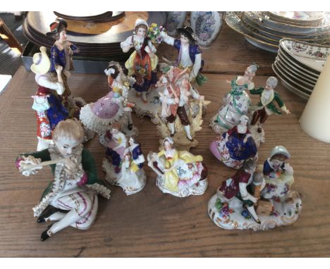 A group of ten assorted ceramic figures to include courting couple and boy with flute.