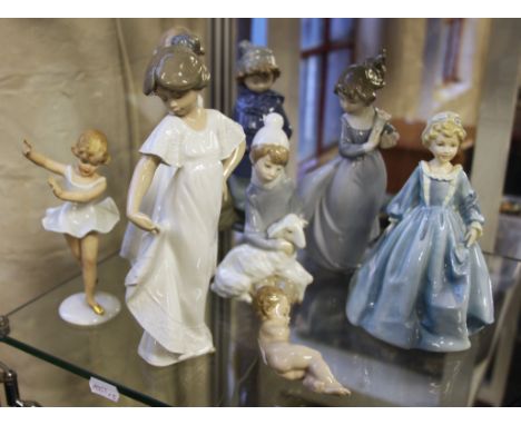 A group of assorted lady ornaments including Royal Worcester Grandmother’s Dress, Lladro, 5 Nao and another.