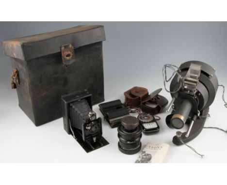 A Hunter film strip projector, Ross Teleross 12cm lens, Erneman folding camera and two Weston Master III meters.