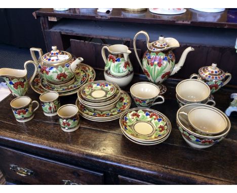 A 19th Century Wedgwood part tea service with hand painted floral and lustre decoration.