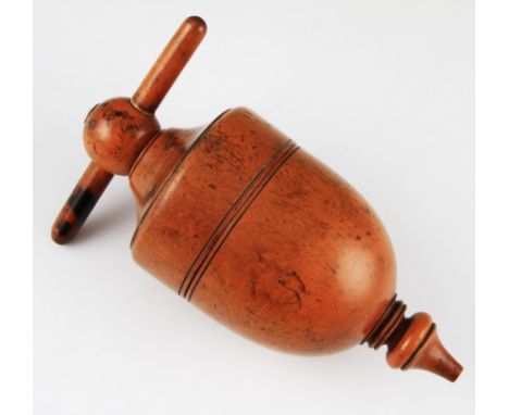 A 19th Century treen fruit wood lemon squeezer having rounded body with screw action to top plus nozzle to base, length 18cm.