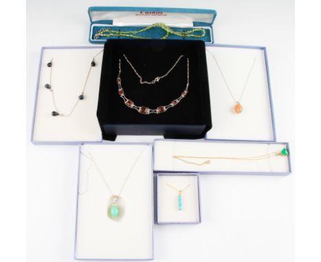 A lot to include a topaz drop necklet, a turquoise pendant, a green stone triangular cabochon, a clarified amber necklet, a g