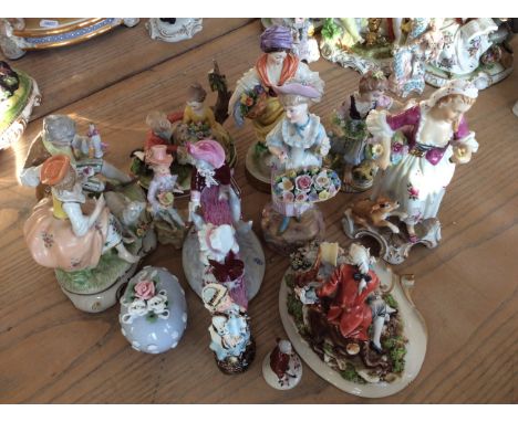 A collection of twelve assorted ceramic figurines to include lady with dog, courting couple and flower girl.