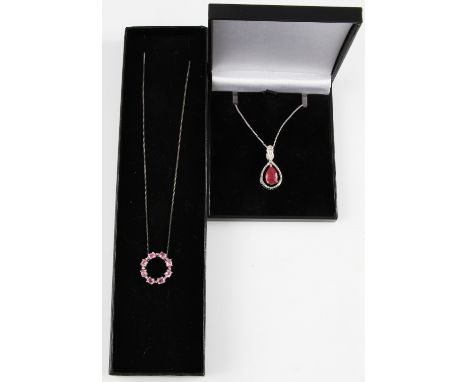 A pear cut ruby pendant together with a pink tourmaline halo pendant, both with chains, stamped 925, (2).