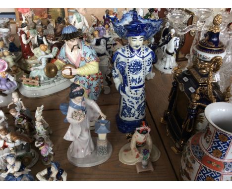 Four oriental ceramic figurines.