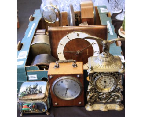 A group of fourteen assorted clocks to include brass bodied clock with eagle finial to top with movement by The British Unite