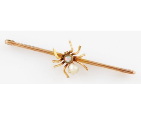 A yellow metal spider bar brooch, set with an opal and baroque pearl to body, unmarked.