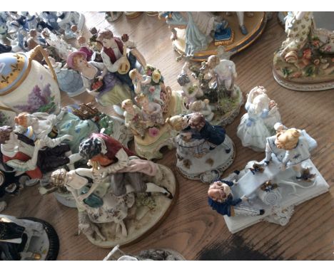 Eight ceramic figurines, one of children on seesaw and three large peasant couples.