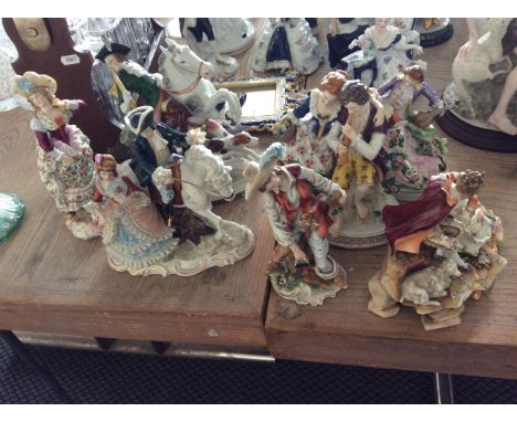 Seven ceramic figurines with gold detail including drinking man and man on horse.