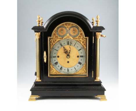 A 19th Century gilt brass and ebonised bracket clock with triple fusee movement and pull repeater cord, the body having four 