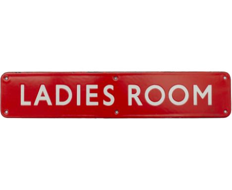 BR(NE) enamel doorplate LADIES ROOM. In excellent condition with minor edge chipping. Measures 18in x 3.5in.