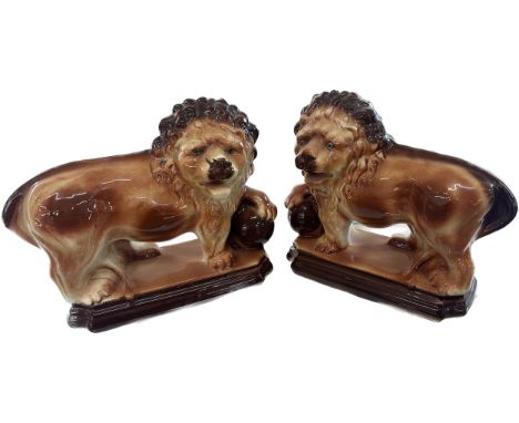 Two vintage porcelain lions overall height 11 inches tall x 14 long, makers mark to bottom