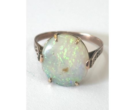 Unmarked 9ct gold ladies opal dress ring, total weight 1.8 grams