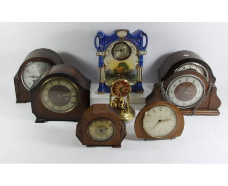 A Victorian Postman's alarm clock with painted 18cm dial, together with a porcelain parlor clock, anniversary, carriage and t