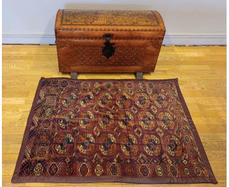 A leather bound and brass studded trunk/chest - W:90cm H:50cm D:40cm.