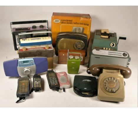 A collection of vintage technology, to include transistor radios, portable phones, calculators, a Remington shaver, a mid 20t