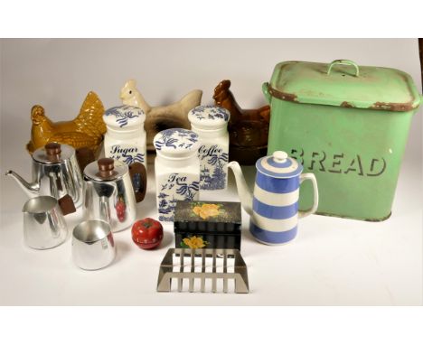 A mid 20th Century white enamelware flour bin, together with a green enamel bread bin, various sized enamel dishes, galvanise