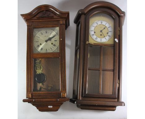 A Vienna style 31 day wall clock by Lincoln, together with a Hermle 8 day wall clock with two other manual wind examples and 