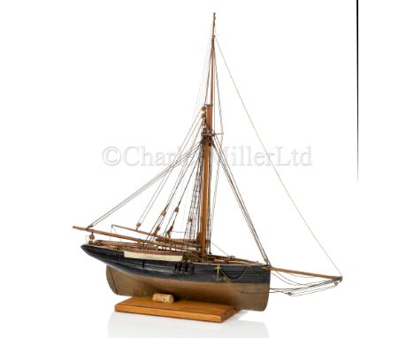 A 19TH CENTURY MODEL FOR A GAFF-RIGGED PILOT CUTTER OF CIRCA 1820 the hull carved from the solid with scored deck, wood and m