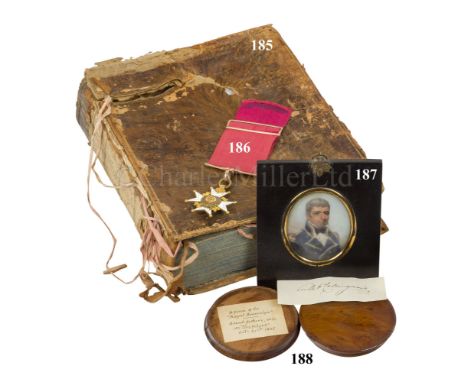 CAPTAIN ROTHERAM'S SURVIVING COPY OF THE ENCYCLOPEDIA BRITANNICA DAMAGED IN HIS CABIN ABOARD COLLINGWOOD'S FLAGSHIP, H.M.S. R